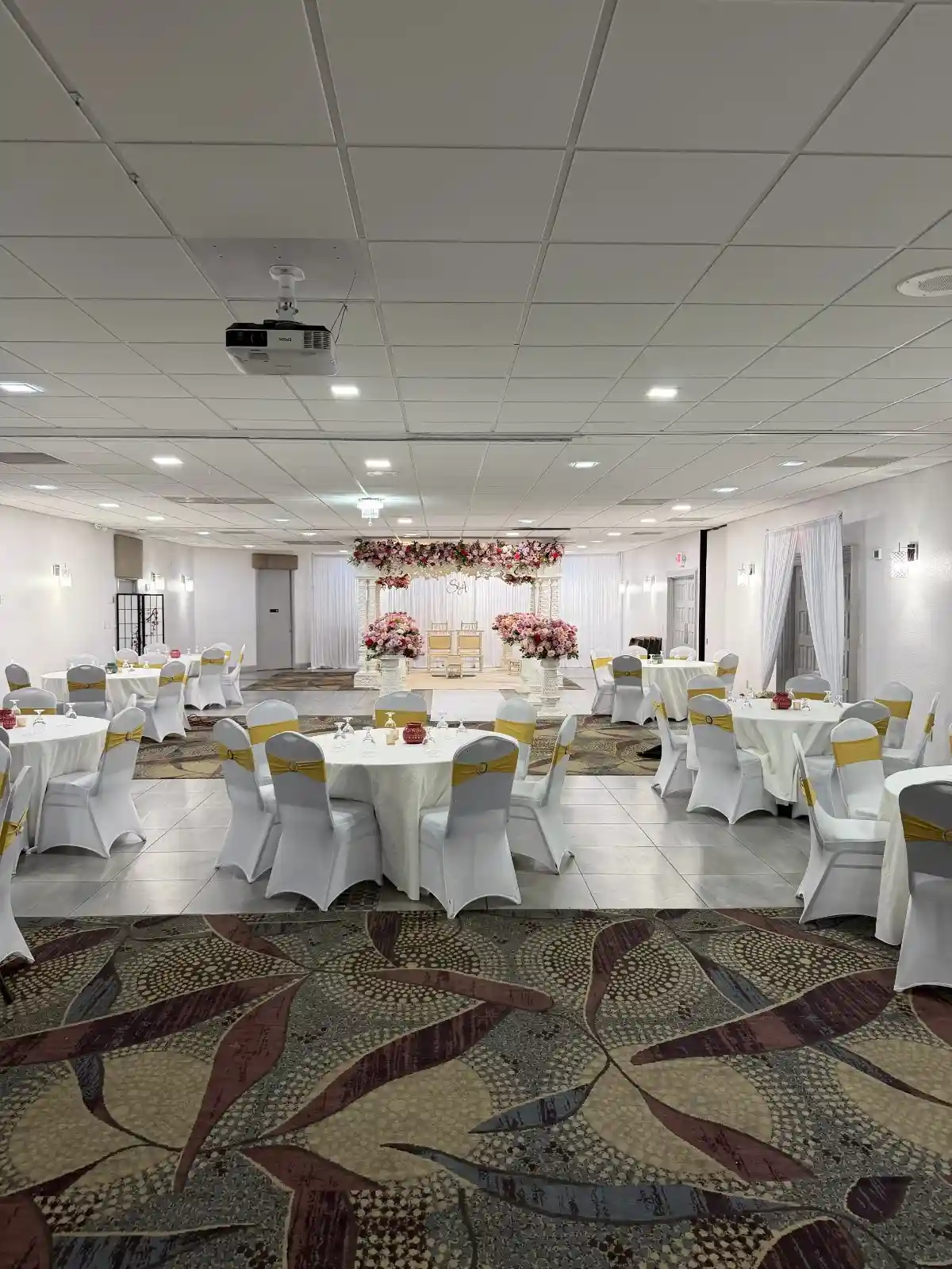 Grand empty ballroom with ornate chandeliers